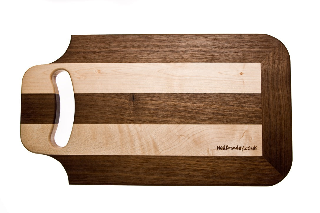 Walnut and Sycamore cutting board with handle.