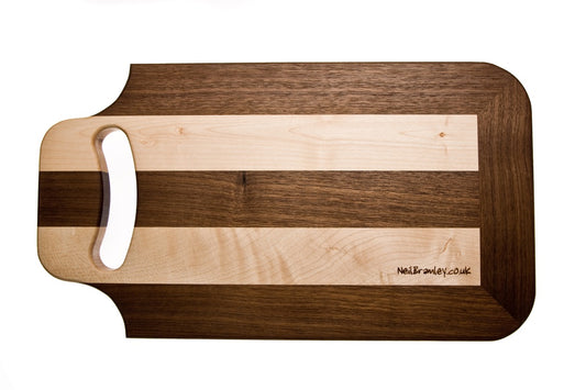 Walnut and Sycamore cutting board with handle.