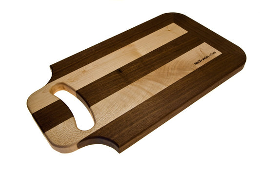 Walnut and Sycamore cutting board with handle.
